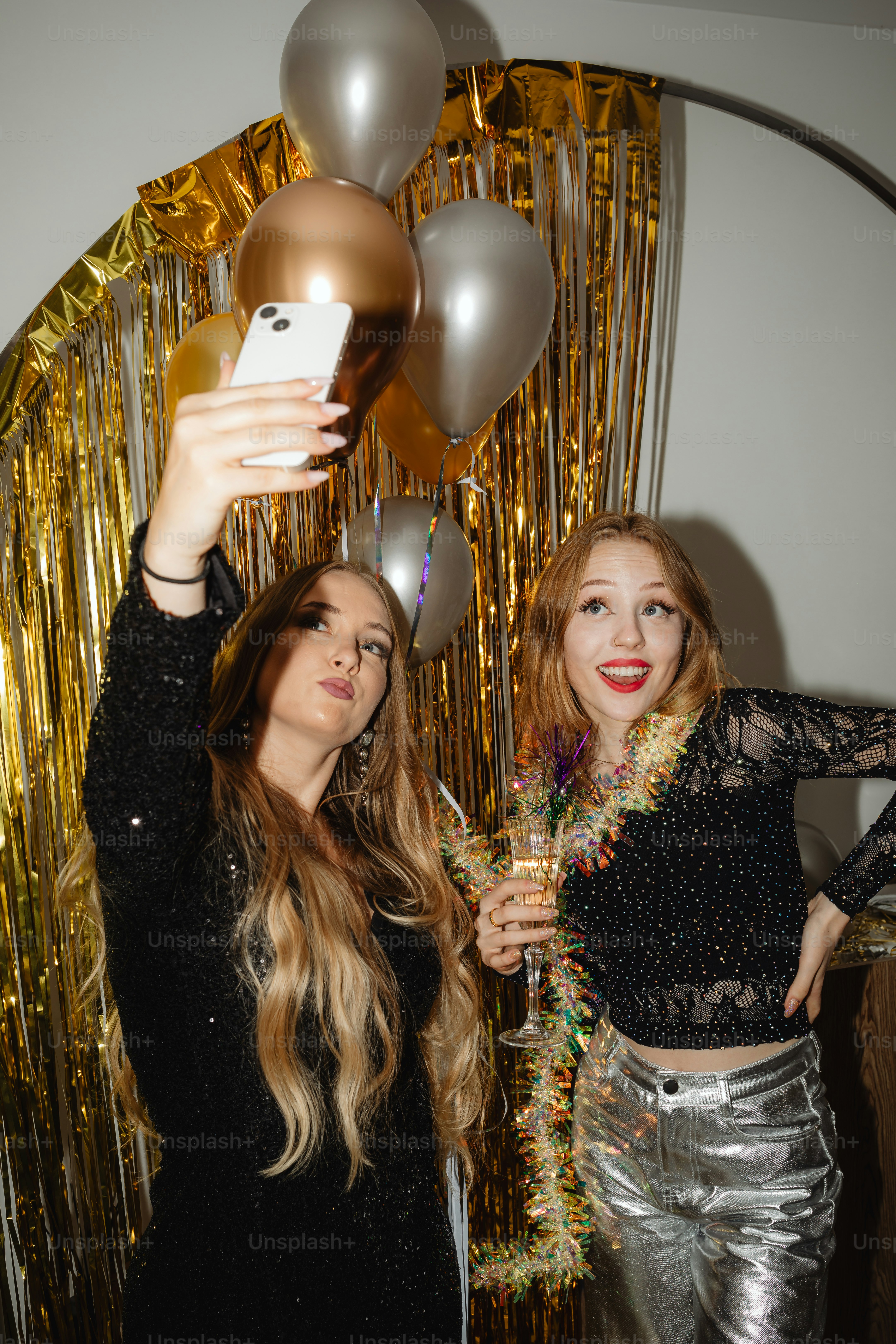 two beautiful young women standing next to each other