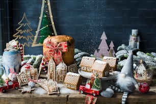 a wooden table topped with lots of christmas decorations