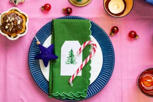 a plate with a candy cane on top of it