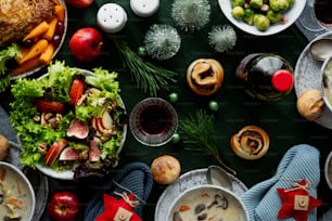 a table topped with plates of food and bowls of soup