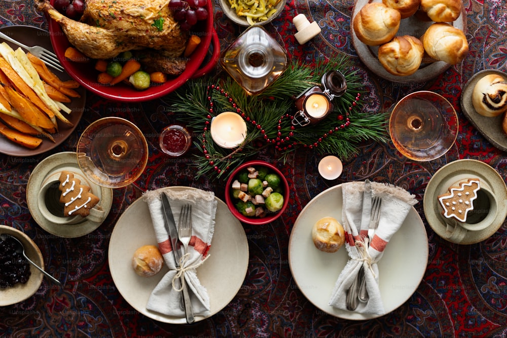 a table topped with plates and bowls filled with food