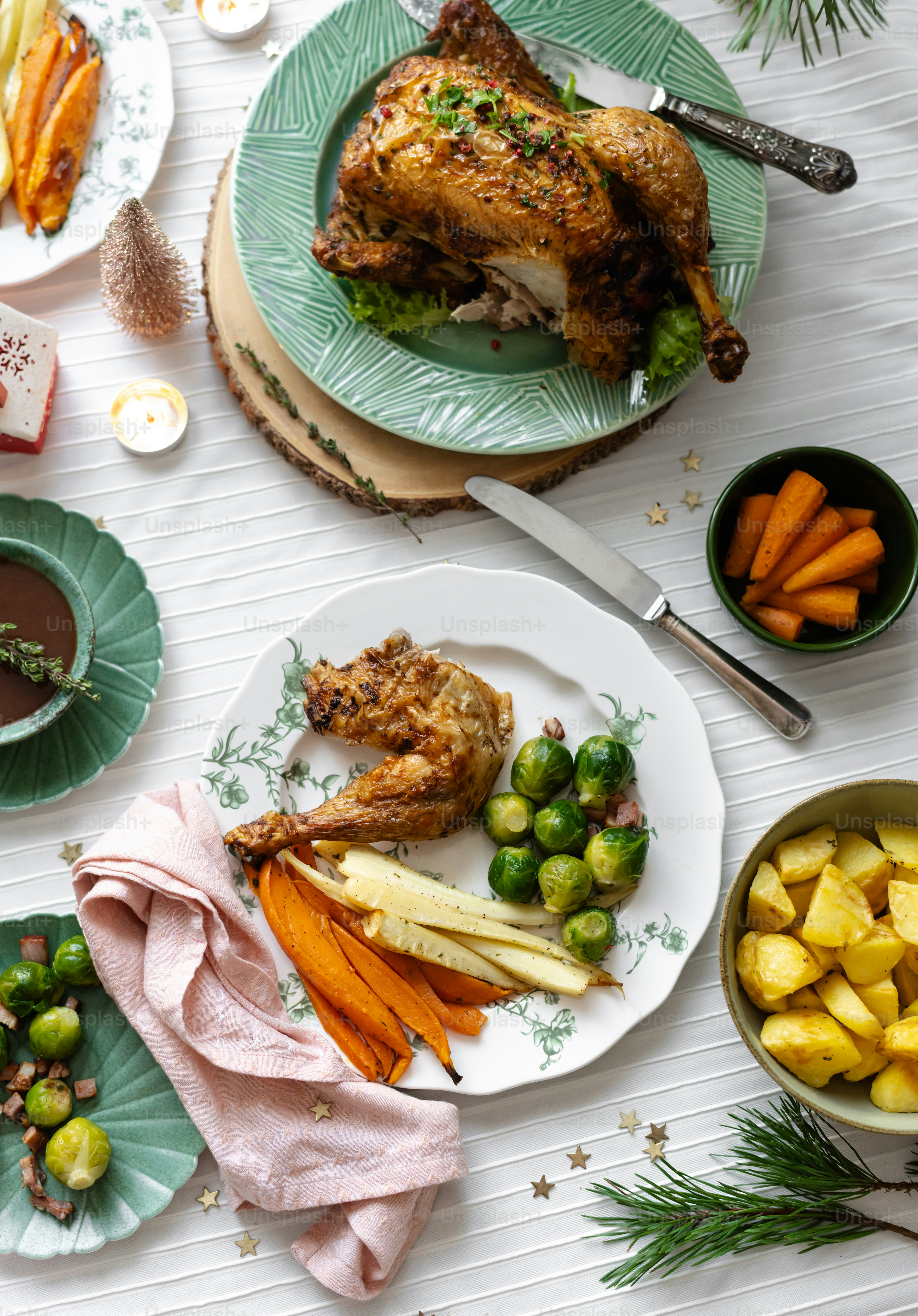 a white table topped with plates of food