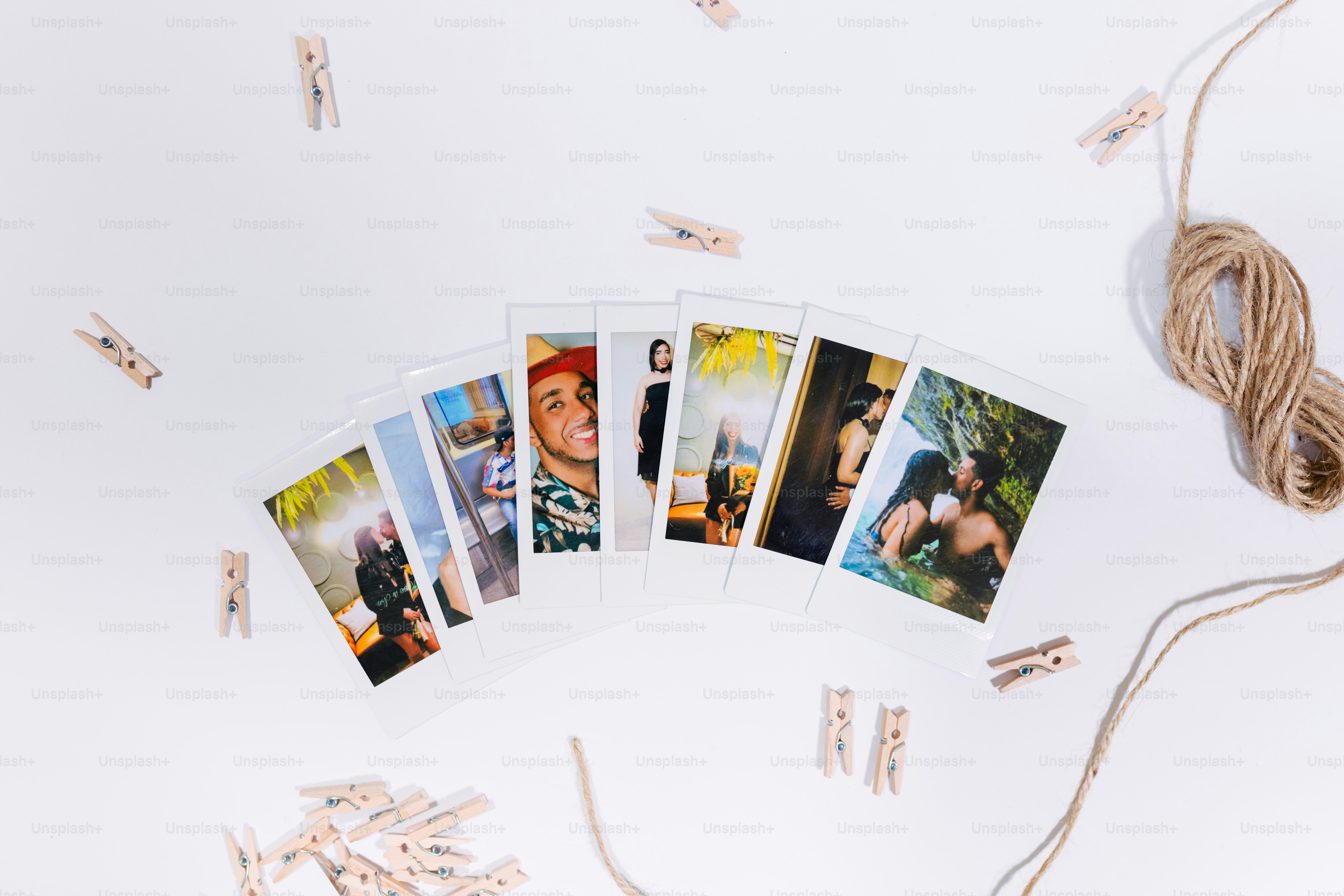 a string of clothes pins with pictures of people on them