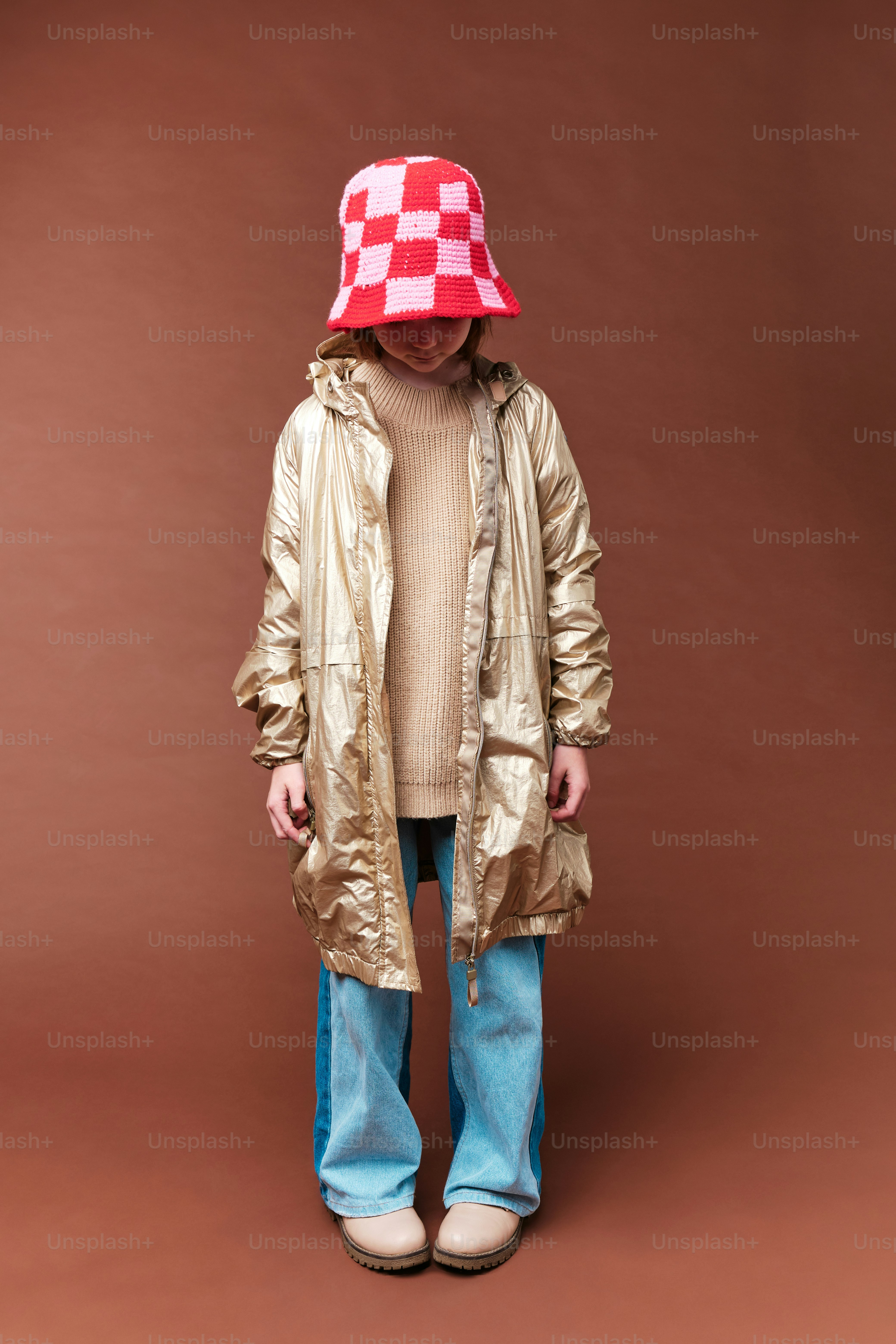 a man wearing a red and white checkered hat