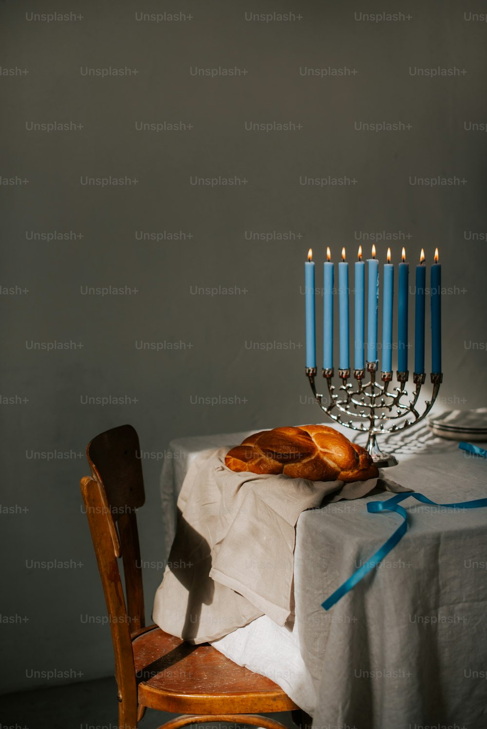 a lit menorah sitting on top of a table