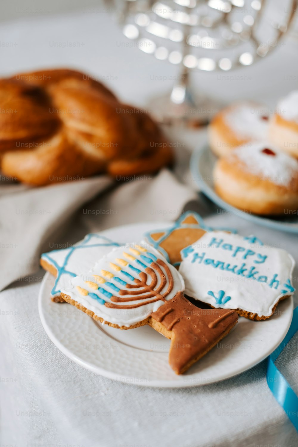 a plate of cookies and pastries on a table
