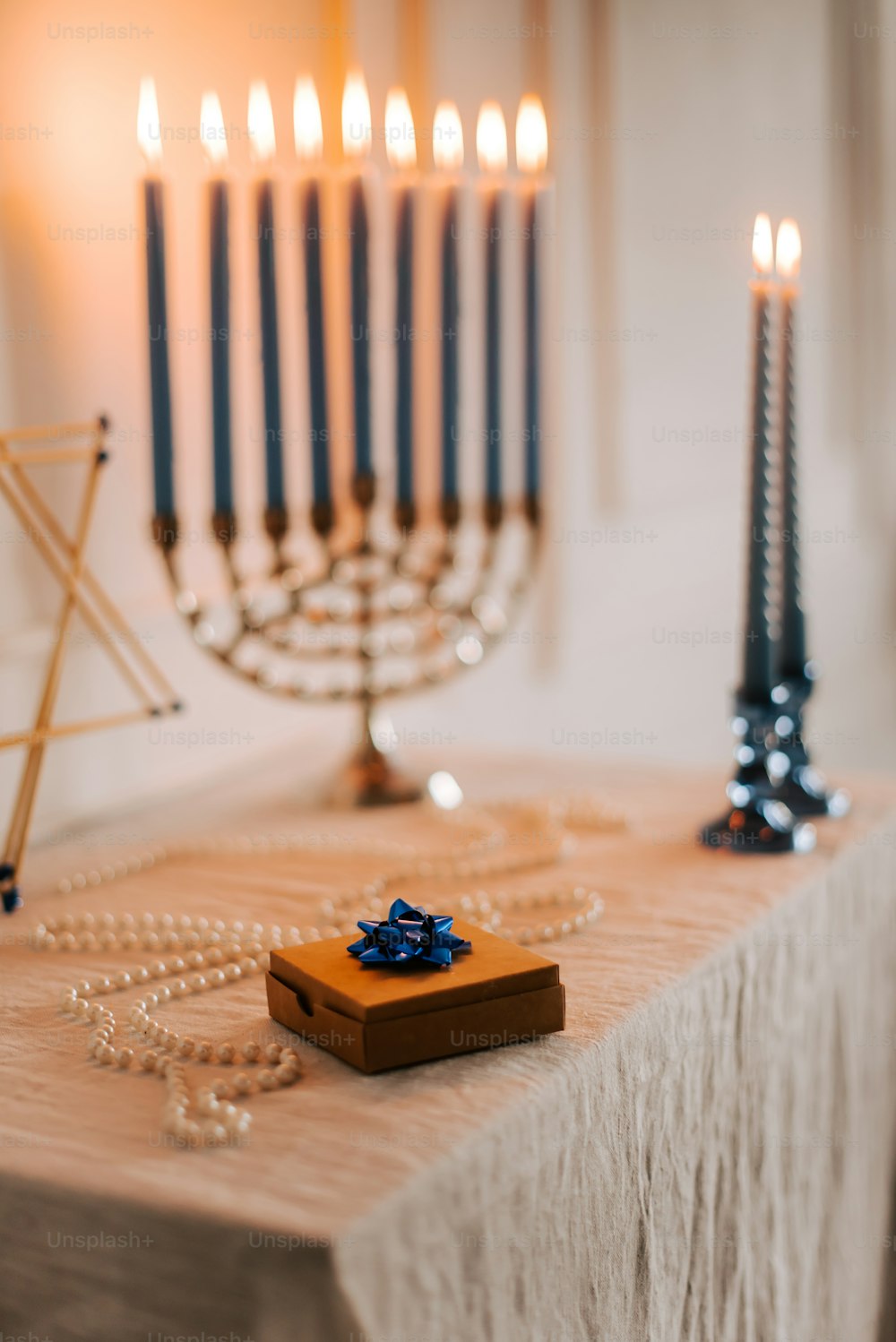 a menorah and a necklace on a table