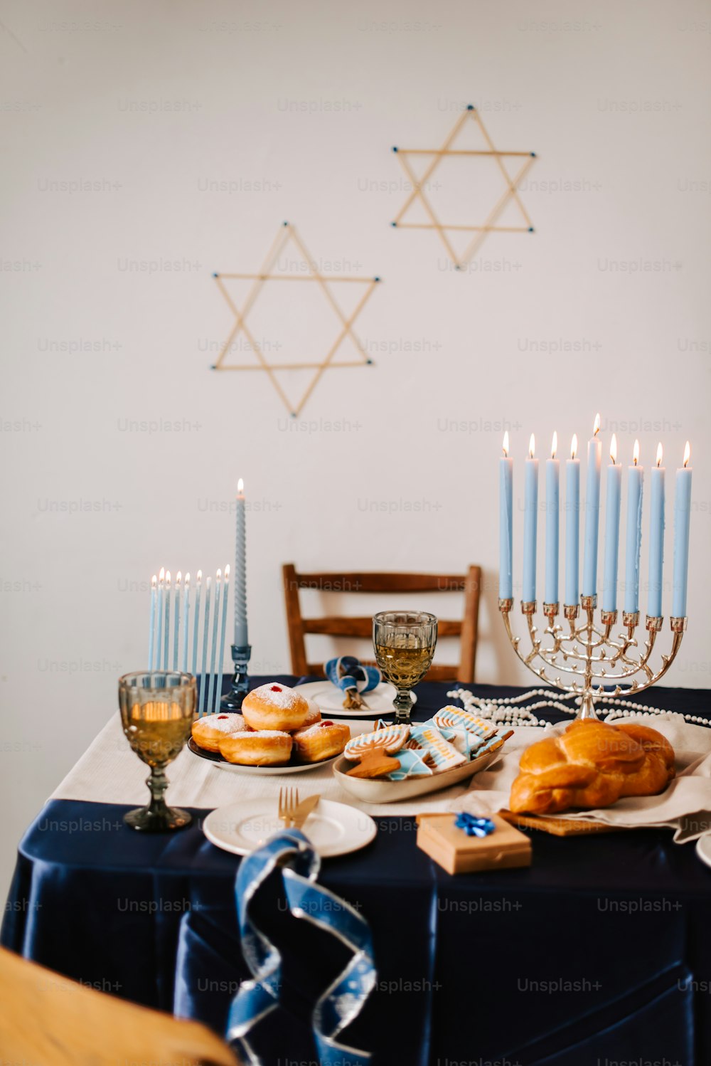 a table topped with donuts and candles