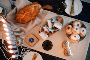 a table topped with lots of pastries and desserts