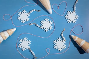 a group of snowflakes and cones on a blue surface