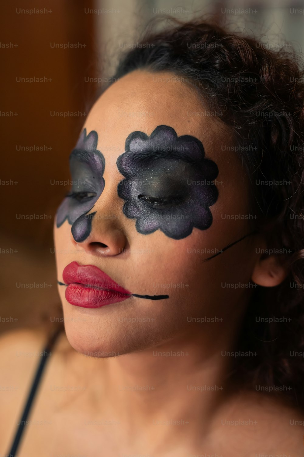 a woman with makeup painted to look like clouds