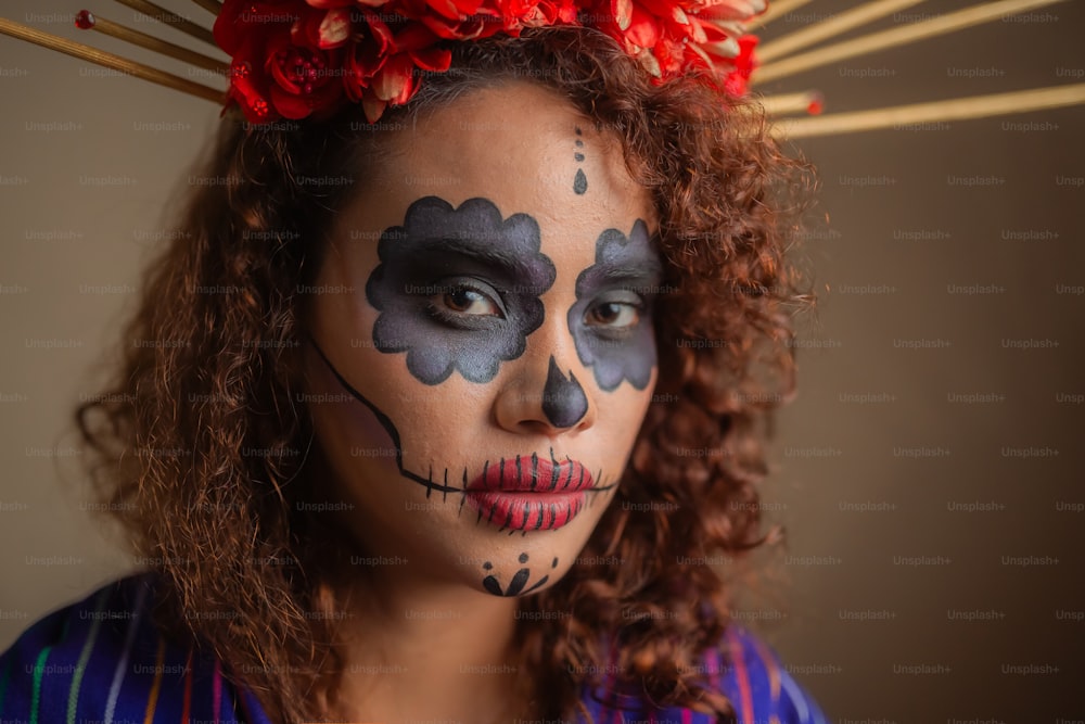 a woman with makeup painted to look like a skeleton
