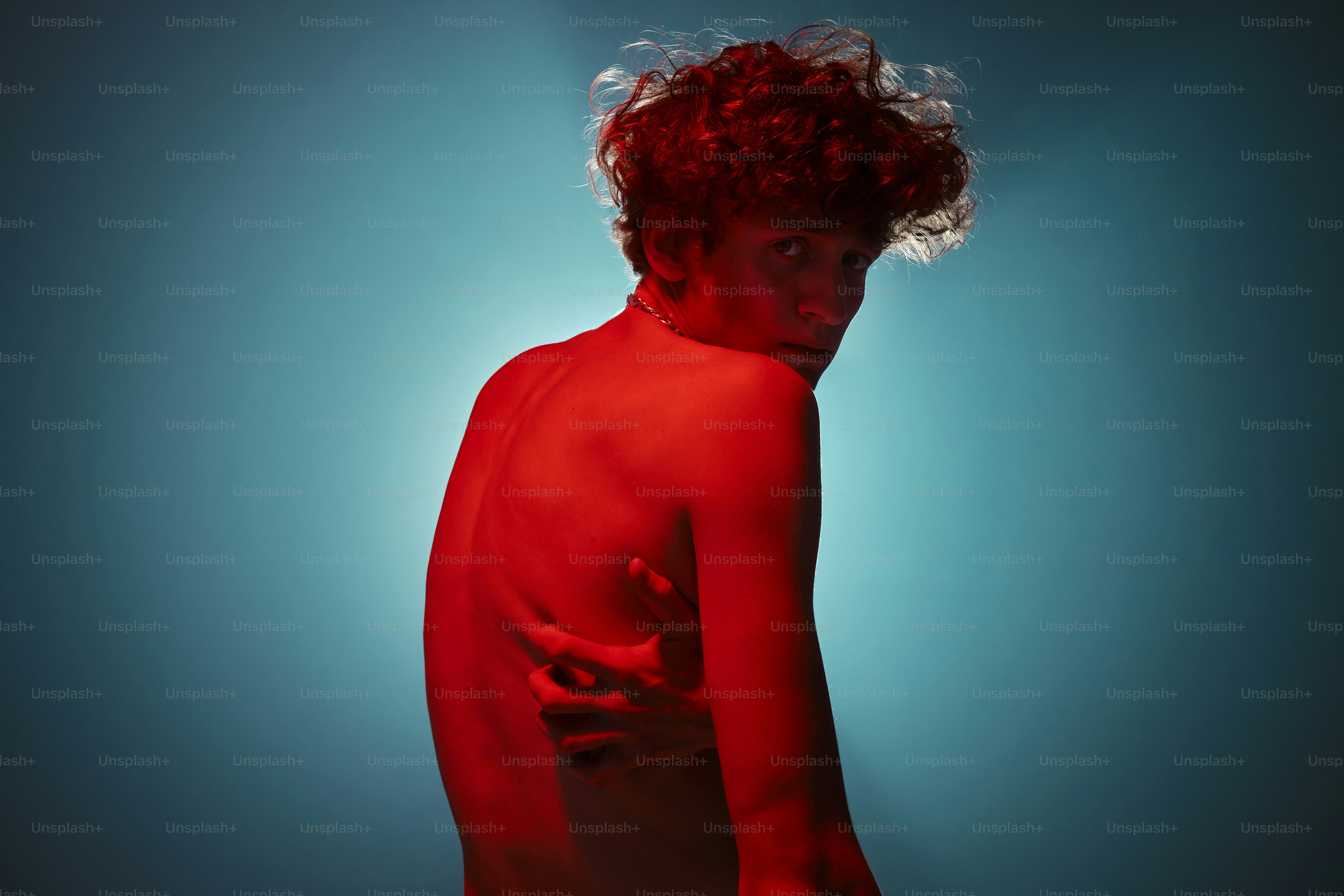 a woman with red hair posing for a picture