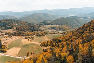 a scenic view of a valley surrounded by mountains