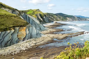 The Acantilado Flysch in Zumaia - Basque Country. Flysch is a sequence of sedimentary rock layers that progress from deep-water and turbidity flow deposits to shallow-water shales and sandstones.