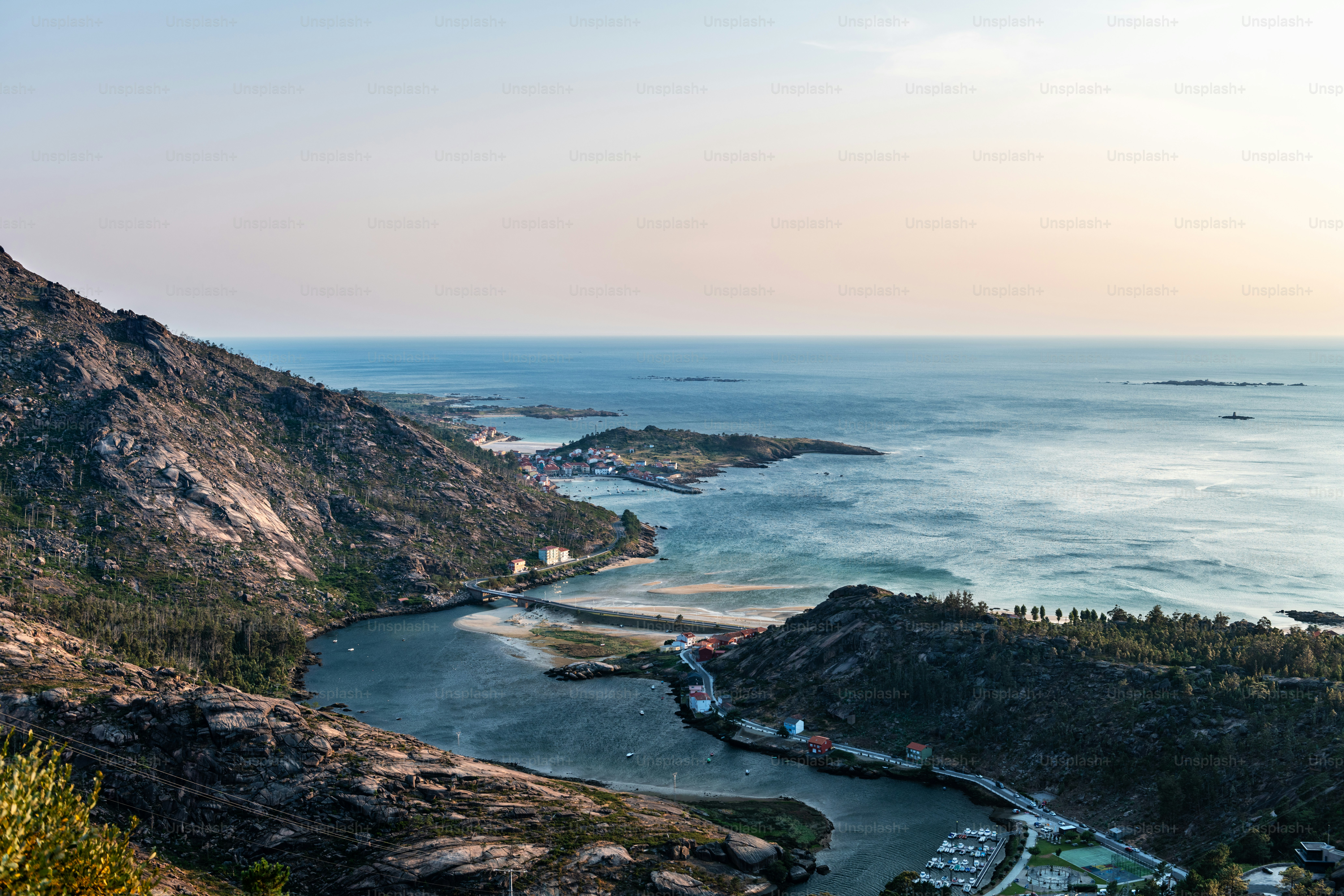 Aerial view of the Ria de Corcubion and Finisterre’s Cape from the top of Mount Pindo at dusk.
