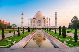 Taj Mahal is a white marble mausoleum on the bank of the Yamuna river in Agra city, Uttar Pradesh state, India