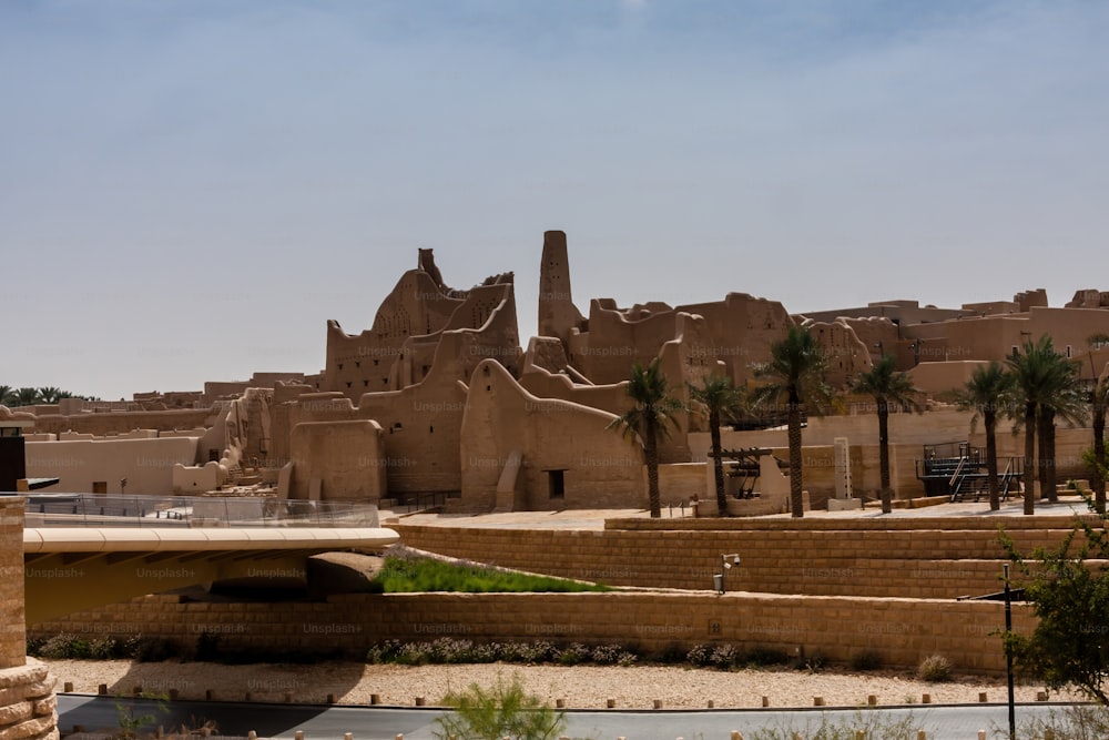 The ruins of the old city of Diriyah lay on either side of the narrow valley known as Wadi Hanifa, which continues southwards through Riyadh and beyond. Consisting almost entirely of mud-brick structures, the ruins are divided into three districts, Ghussaibah, Al-Mulaybeed, and Turaif, set on top of hills overlooking the valley.