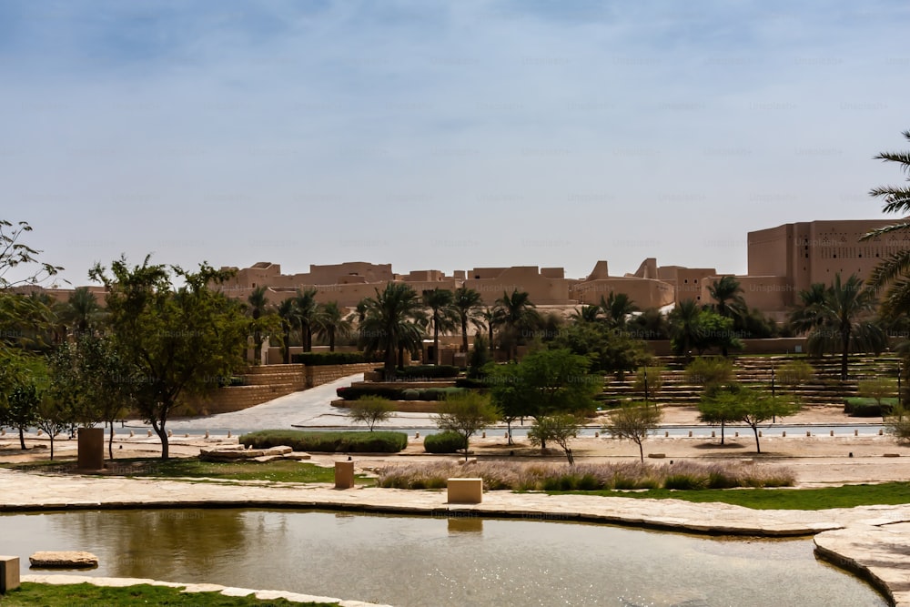 The ruins of the old city of Diriyah lay on either side of the narrow valley known as Wadi Hanifa, which continues southwards through Riyadh and beyond. Consisting almost entirely of mud-brick structures, the ruins are divided into three districts, Ghussaibah, Al-Mulaybeed, and Turaif, set on top of hills overlooking the valley.