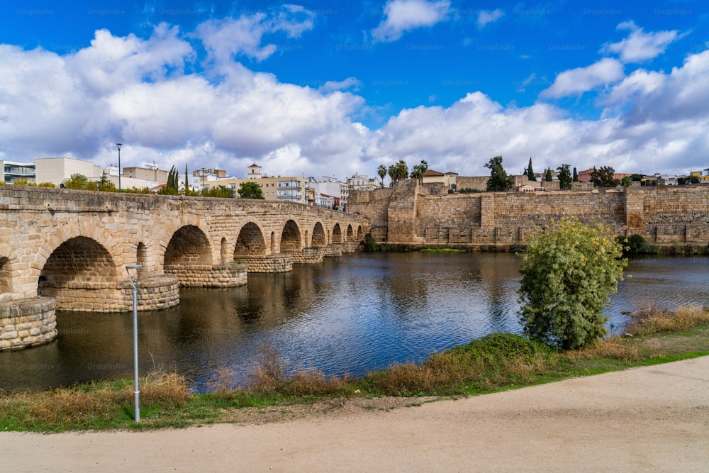 Puente Romano, the Roman Bridge in Merida, Extremadura, Spain. It is the longest surviving Roman bridge, over the Guadiana River in Merida. In the background we see the Alcazaba.