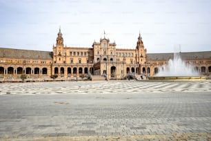 Famous Plaza de Espana. Spanish square in the centre of old but magnificent Seville, Spain. Unique moorish architecture. Built in 1929, is a huge half circle with a total area of 50,000 square meters