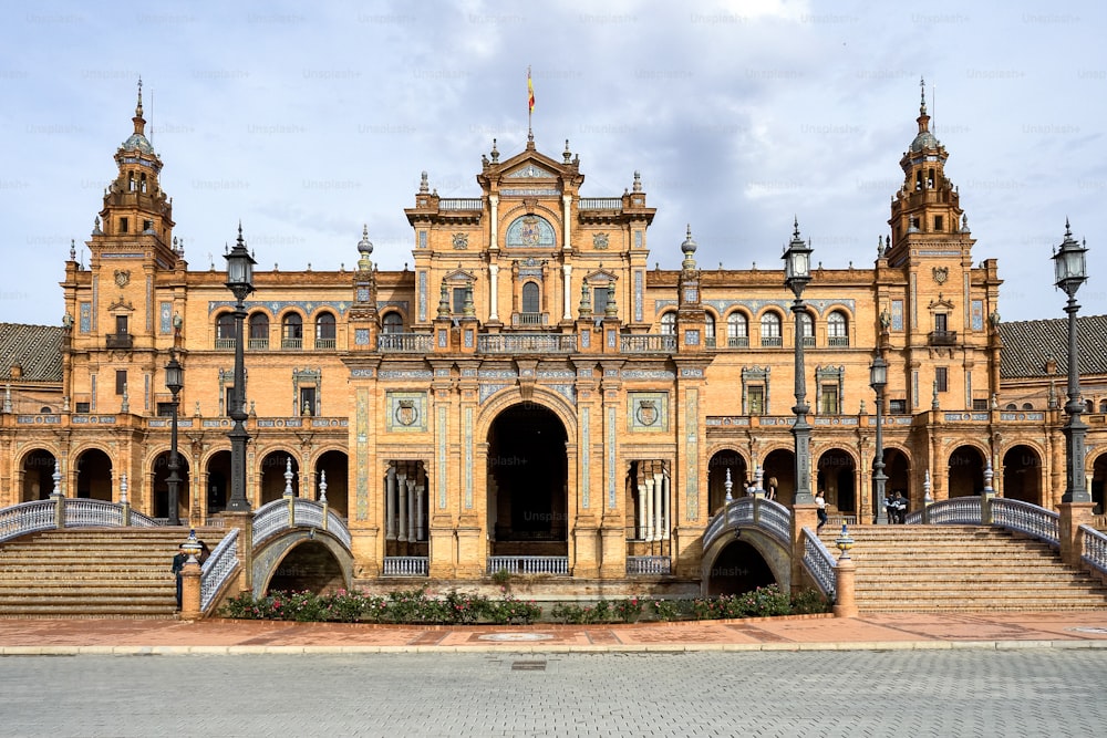 Famous Plaza de Espana. Spanish square in the centre of old but magnificent Seville, Spain. Unique moorish architecture. Built in 1929, is a huge half circle with a total area of 50,000 square meters