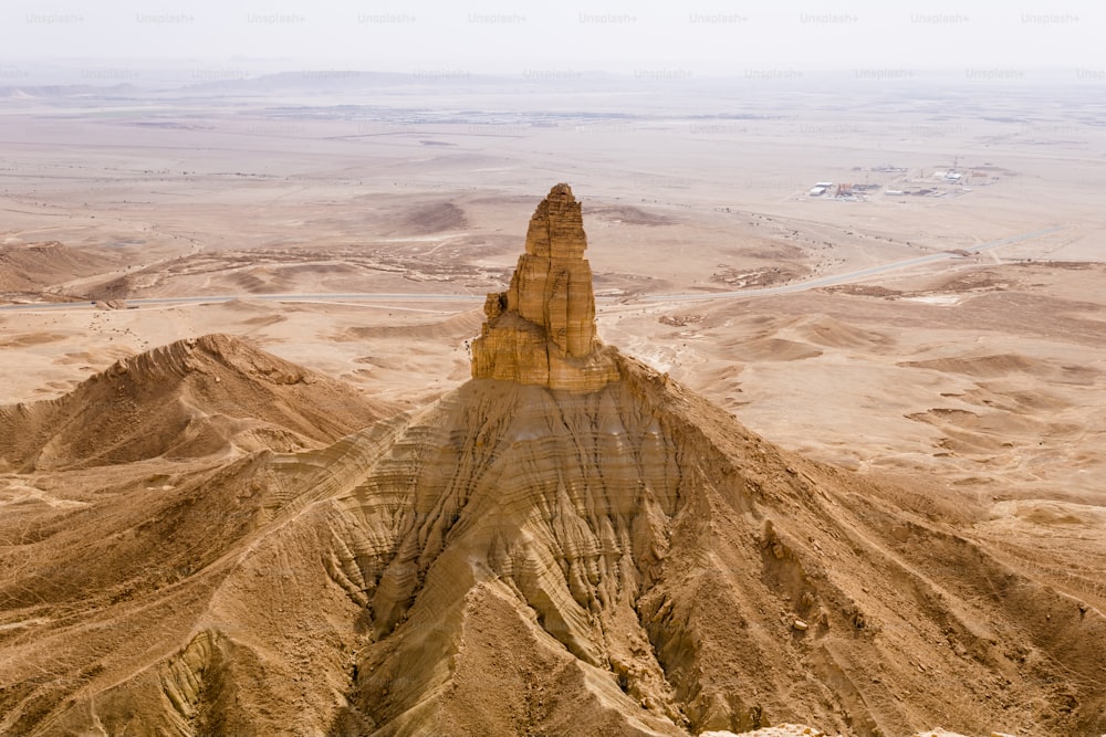 The Faisal's Finger Rock is a natural stand-alone rock about 200 m in height near the Jabal Tuwaiq escarpment, a geological wonder near Riyadh.