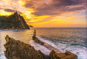 Sunset at the lighthouse in the municipality of Pasajes San Juan in Gipuzkoa. Basque Country