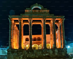 The Roman temple of Diana in Merida illuminated at night, province of Badajoz, Extremadura in Spain.