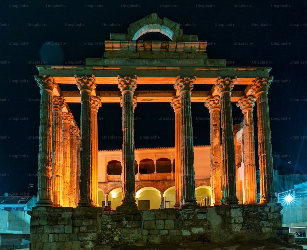 The Roman temple of Diana in Merida illuminated at night, province of Badajoz, Extremadura in Spain.