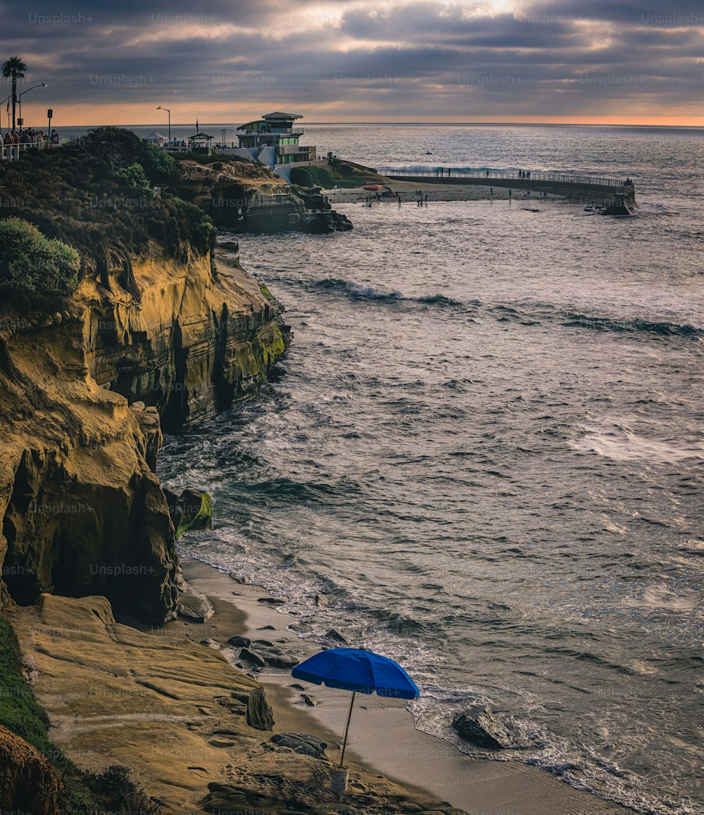 THE CHILDRENS POOL WITH THE ROCKY COASTLINE AND SMALL SAND BEACH OFF OF LA JOLLA CALIFORNIA NEAR SAN DIEGO-
