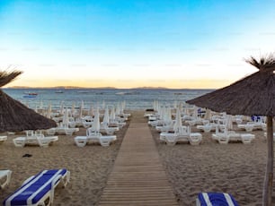 An empty Mediterranean beach in the south of France with sunbeds