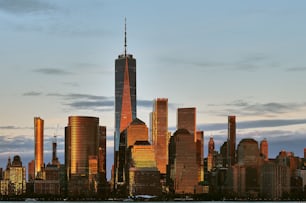 The New York City skyline at Manhattan downtown viewed from across Hudson River at sunset, USA