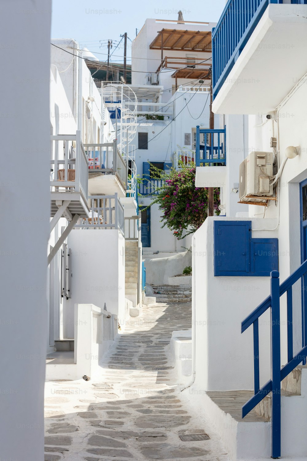 A vertical shot of beautiful streets and historical buildings of Mykonos, Greece