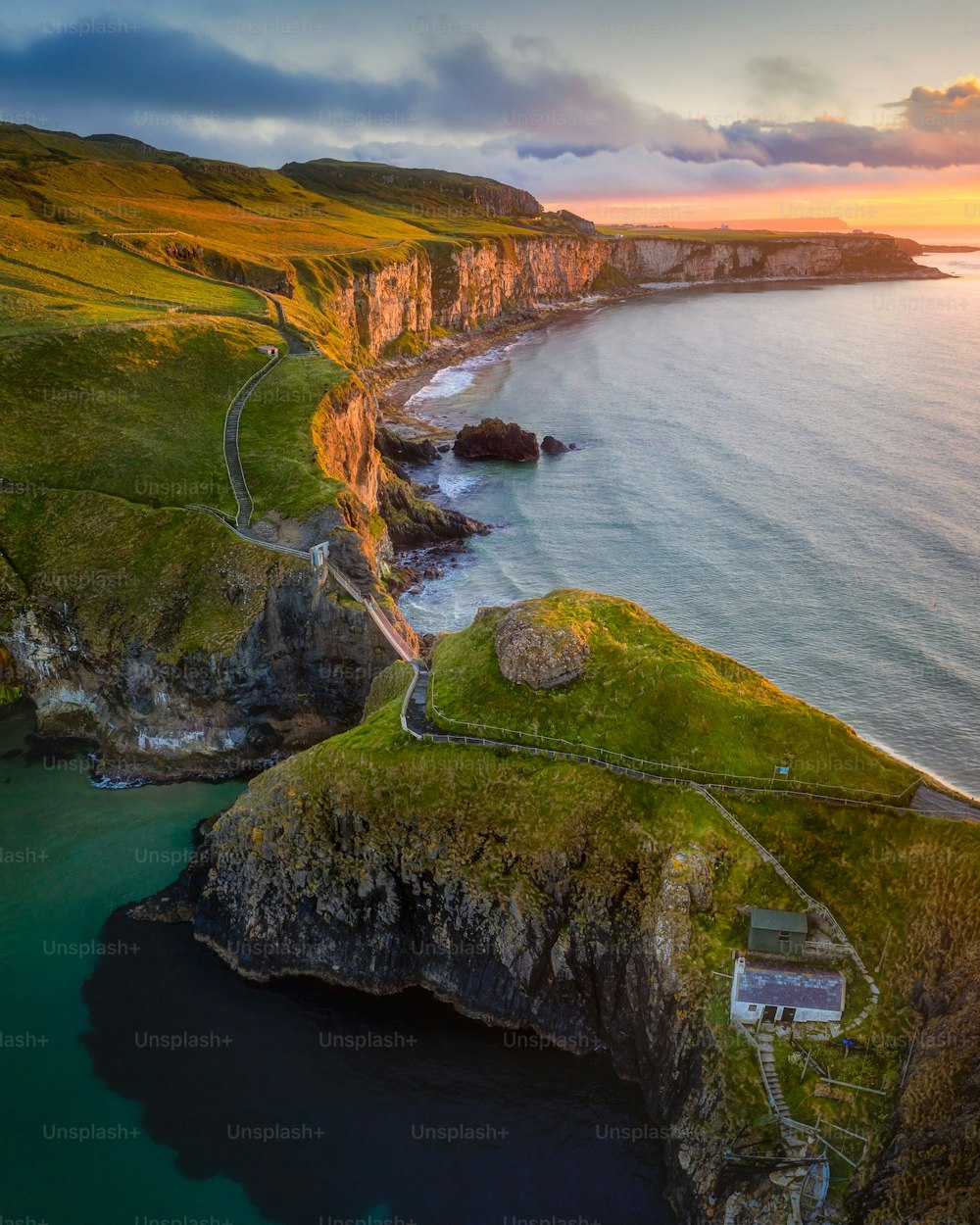 A charming view of the Carrick-a-Rede Rope Bridge at sunrise, Northern Ireland