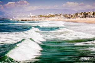 A beautiful shot of the Venice Beach with waves in California