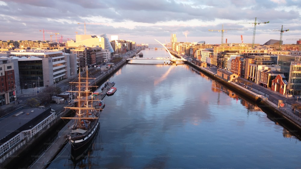 An aerial view of the fabulous Samuel Beckett Bridge with modern buildings in Dublin, Ireland