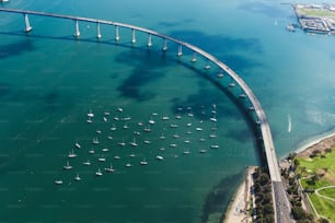 An aerial shot of the Mission bridge in San Diego, California, surrounded by the ocean