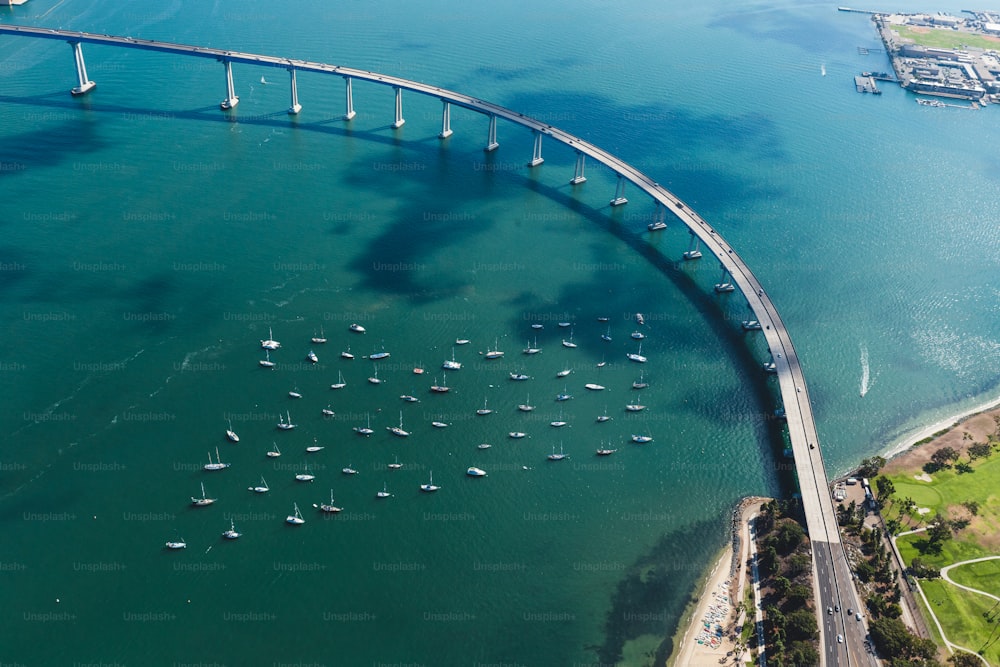 An aerial shot of the Mission bridge in San Diego, California, surrounded by the ocean