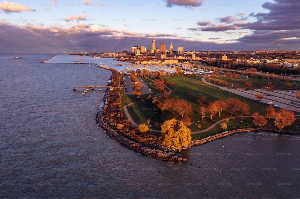 An aerial view of downtown Cleveland at sunset with the docks at Edgewater Park in front