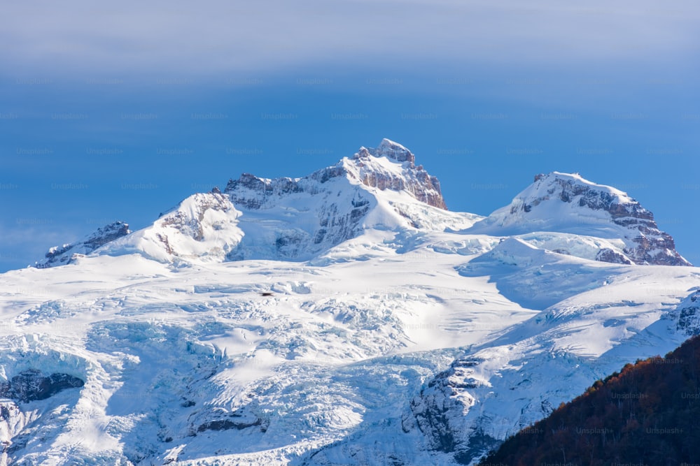 A beautiful view of the snowy Tronador stratovolcano against the blue sky in the southern Andes