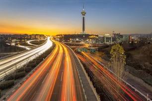 Skyline of Tehran with Milad tower at sunset.