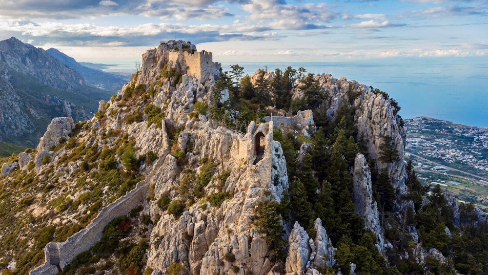 An aerial drone shot of the St. Hilarion Castle Peak in Karmi, Cyprus