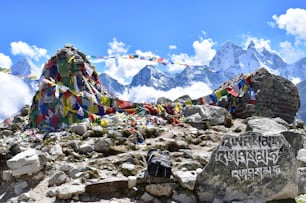A beautiful view of Everest Base Camp in Khumjung, Nepal, with flags under the blue sky