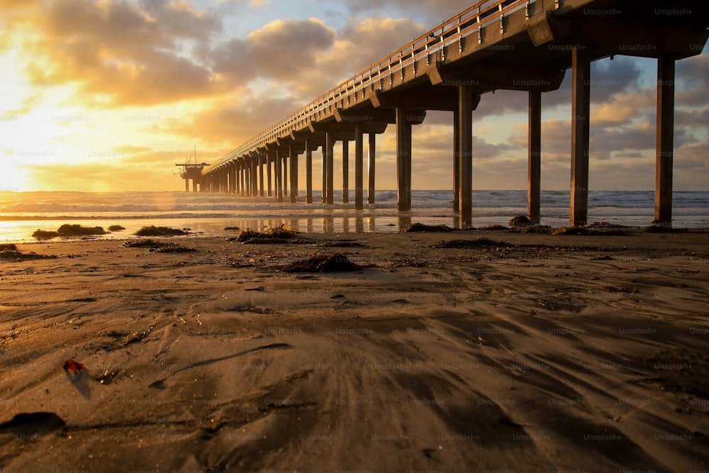 A scenic view of Ellen Browning Scripps Memorial Pier in California during sunset