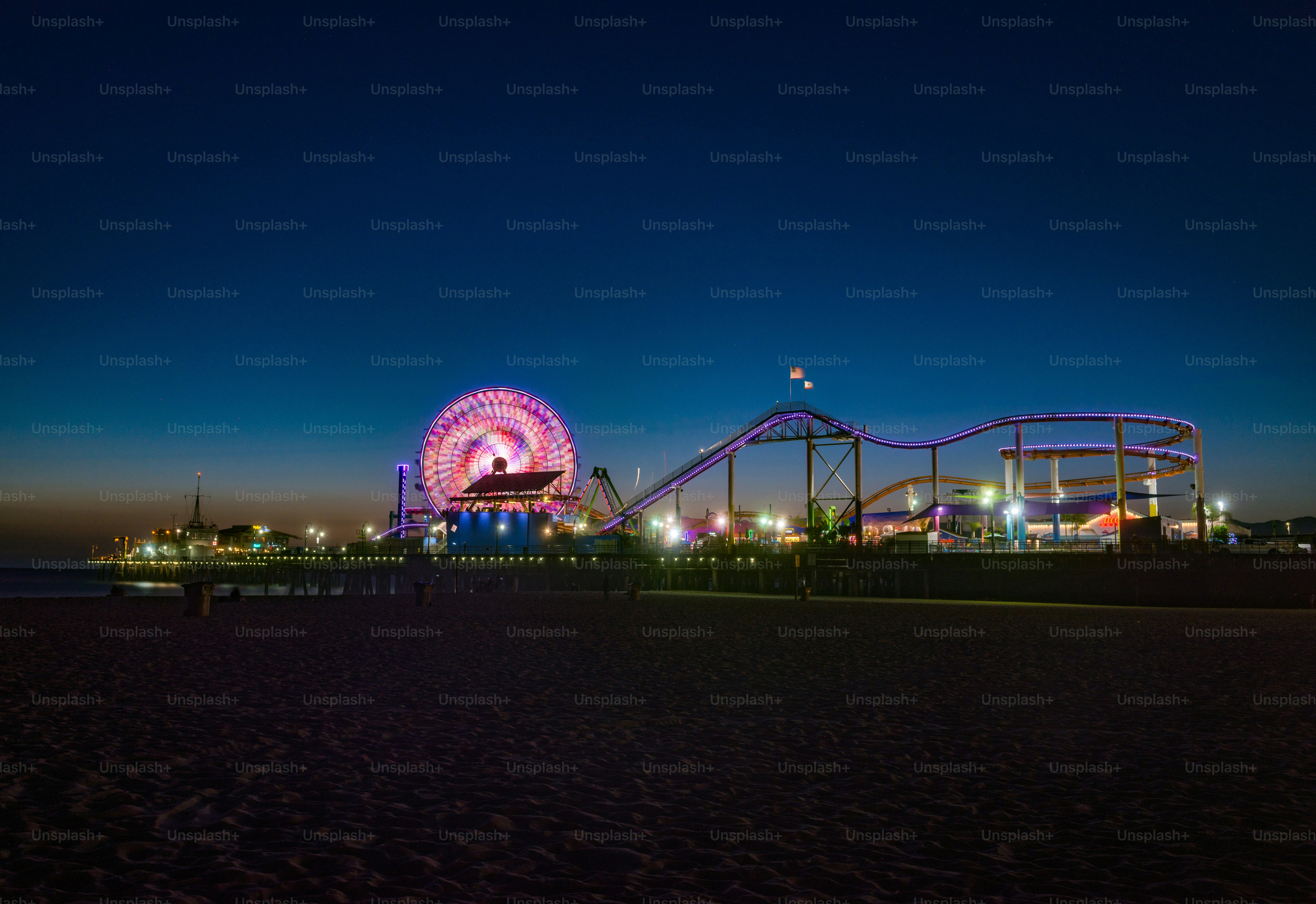 The illuminated roller coaster in Santa Monica, CA at night