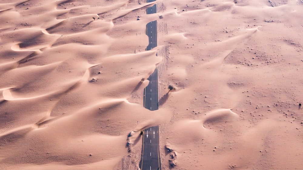 A highway covered by sand after a sandstorm in a desert in UAE