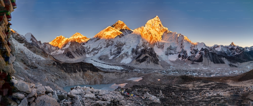 A panoramic shot of the Khumbu glacier and the Everest. Lhoste with a clear blue sky in the background