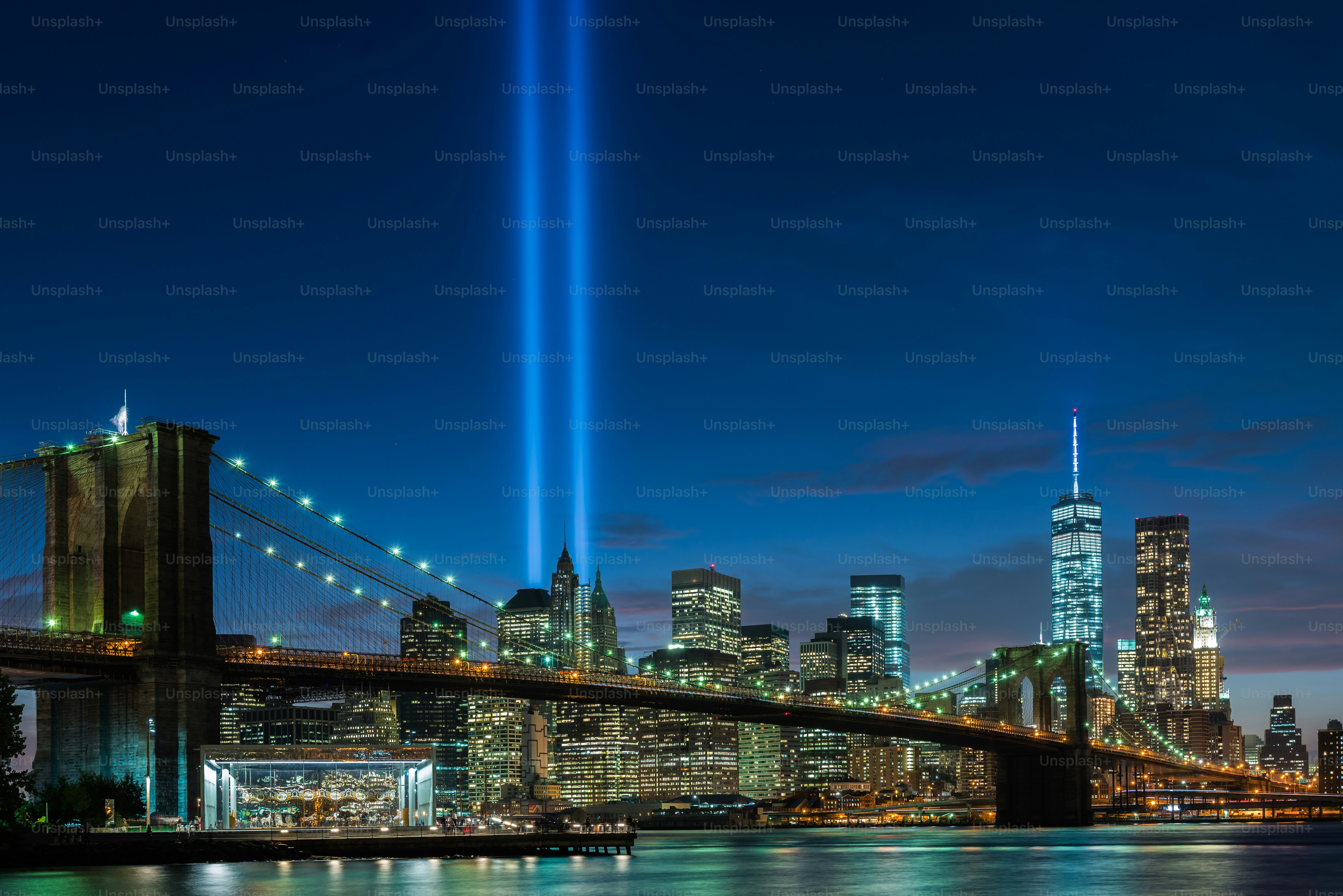 A beautiful shot of brooklyn bridge park of new york city in USA with a beam of light towards the sky