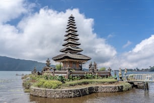 The Pura Ulun Danu Bratan temple in Indonesia with the white clouds in the background